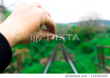 Matches on rails railroad tracks background, fire on railways concept 110383830