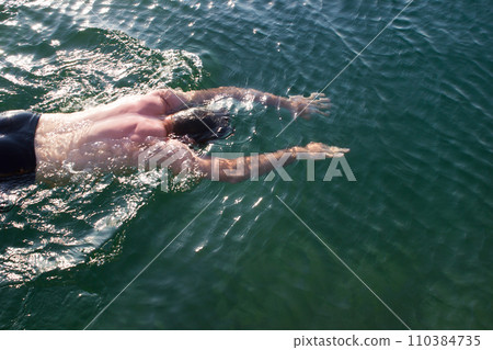 Male young swimmer underwater - sea, swimming lessons, diving Male young swimmer underwater - sea, swimming lessons, diving 110384735