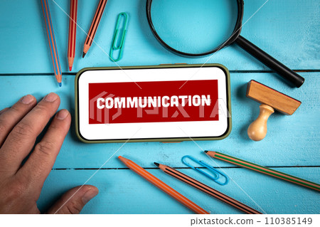 Communication Concept. Mobile phone on wooden office table 110385149