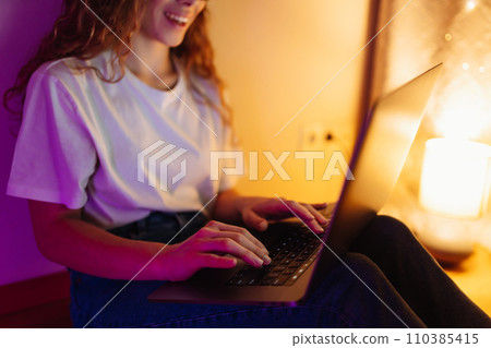 Young woman with laptop. Freelance or studying concept. Online training, shopping, blogging. 110385415