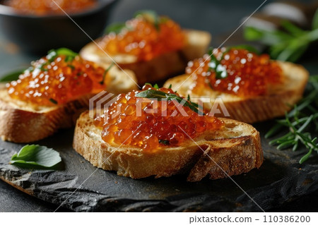 Sandwich with red caviar: a gourmet delicacy on a wooden table Sandwich with red caviar: a gourmet delicacy on a wooden table 110386200