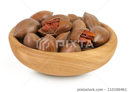 pecan nut in wooden bowl isolated on white background with full depth of field 110386961