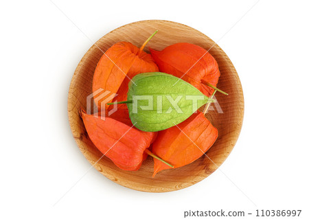 Cape gooseberry, physalis in wooden bowl isolated on white background with full depth of field. Top view. Flat lay Cape gooseberry, physalis in wooden bowl isolated on white background with full depth of field. Top view. Flat lay 110386997