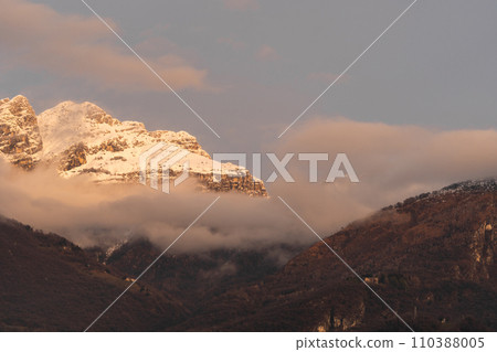 Mountain covered with snow and fog. Alpine landscape in Italy, Europe. Snow-capped mountains Mountain covered with snow and fog. Alpine landscape in Italy, Europe. Snow-capped mountains 110388005