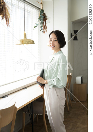 Portrait of a woman with short bob black hair Portrait of a woman with short bob black hair 110389280