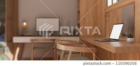 Side view image of a laptop computer mockup on a wooden table in a cosy, Scandinavian office. 110390208