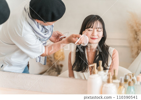 Actress, model, talent, idol woman (cheek) getting makeup done by hair and makeup artist Actress, model, talent, idol woman (cheek) getting makeup done by hair and makeup artist 110390541