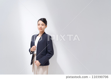 Smiling business woman standing 110390706