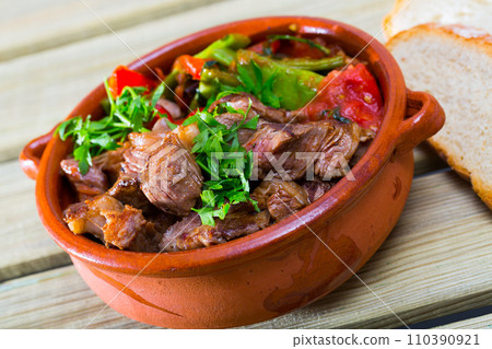 Bulgarian baked meat and vegetables (Gyuvech) 110390921