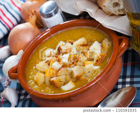 Vegetable soup puree with croutons and cheese Vegetable soup puree with croutons and cheese 110391035