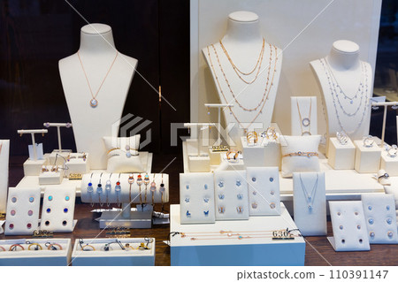 Pendants and bracelets with dimonds in jewelry store 110391147