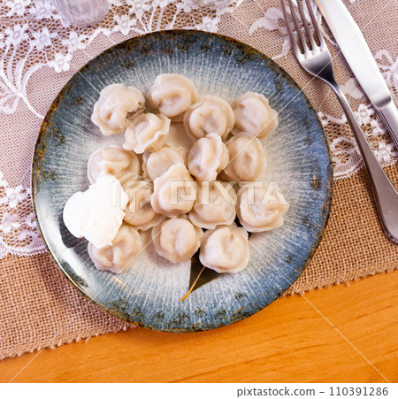 Meat dumplings served on plate in restaurant Meat dumplings served on plate in restaurant 110391286