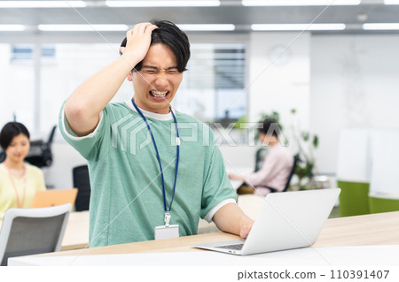 Young male engineer worried in the office 110391407