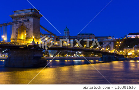Image of Chain Bridge near Buda Fortress in evening illumination of Hungary Image of Chain Bridge near Buda Fortress in evening illumination of Hungary 110391636