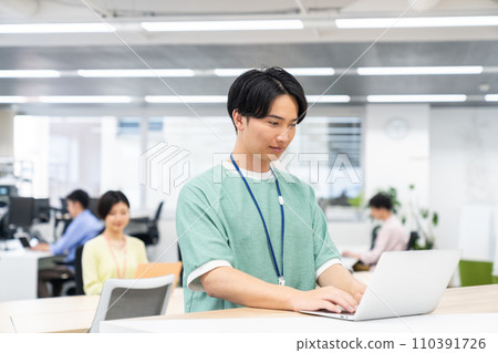 Young male engineer working in the office 110391726