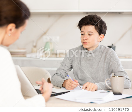 Boy studying with tutor Boy studying with tutor 110391770