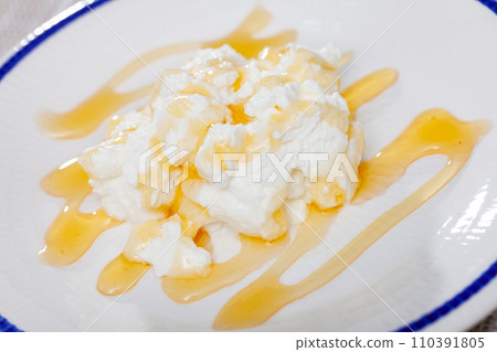 Soft whey cheese mato from goat milk with honey 110391805