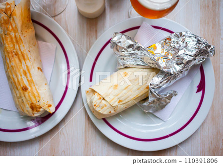 Shawarma with chopped vegetables and greens 110391806