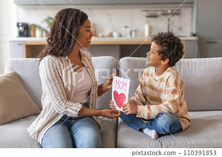 Mother's Day. Son Giving Greeting Card To His Happy Mom At Home 110391853