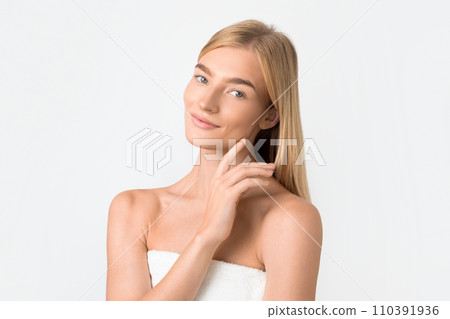 Beautiful Blonde Woman Touching Smooth Facial Skin Posing In Studio 110391936