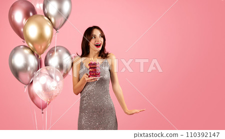 An ecstatic woman with brown hair and red lipstick, wearing a sparkling sequined dress An ecstatic woman with brown hair and red lipstick, wearing a sparkling sequined dress 110392147
