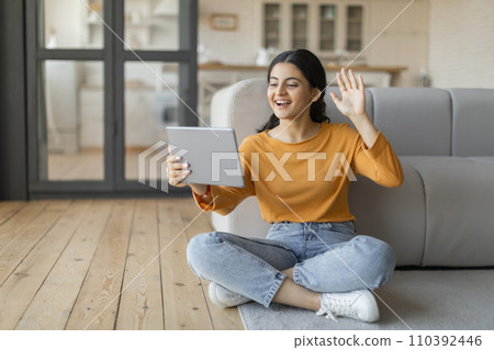 Happy Indian Woman With Digital Tablet Making Video Call At Home 110392446
