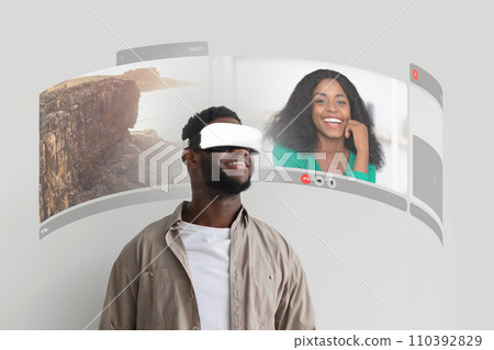 Black Guy Communicating With Girlfriend Making VR Video Call Indoor Black Guy Communicating With Girlfriend Making VR Video Call Indoor 110392829
