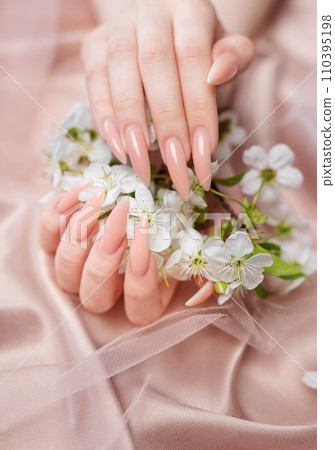 Elegant pastel pink natural manicure. Elegant pastel pink natural manicure. 110395198