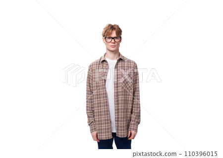 portrait of a caucasian student guy in glasses and a plaid shirt portrait of a caucasian student guy in glasses and a plaid shirt 110396015