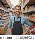 Male store attendant looks at camera and smiles 110396521