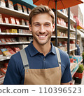 Male store attendant looks at camera and smiles 110396523
