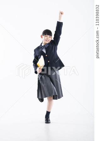 Junior high school girl portrait white background girl junior high school student looking at camera jumping fist pump 110398832