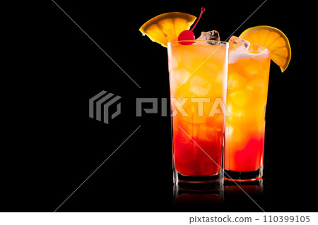 Set of Tequila Sunrise cocktail blend of tequila, orange juice, and grenadine on black 110399105