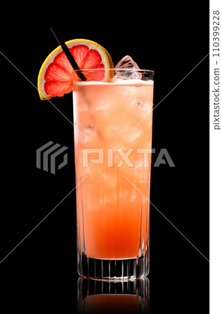 Tequila Sunrise cocktail blend of tequila, orange juice, and grenadine on black Tequila Sunrise cocktail blend of tequila, orange juice, and grenadine on black 110399228