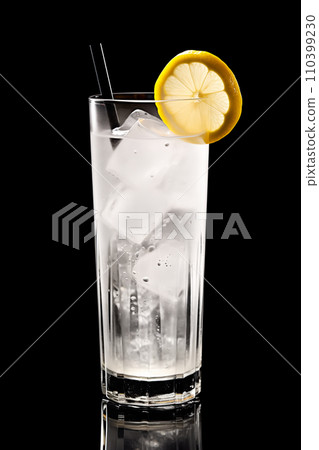 Refreshing classic Tom Collins or Whiskey sour cocktail with a maraschino cherry and lemon slice on black background Refreshing classic Tom Collins or Whiskey sour cocktail with a maraschino cherry and lemon slice on black background 110399230