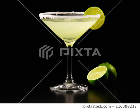 Margarita cocktail in salt-rimmed glass with lime isolated on black background 110399232