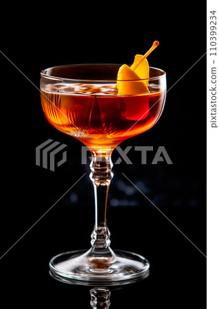 Refreshing Bourbon Manhattan cocktail with vermouth and maraschino cherry garnish isolated on black background/ 110399234