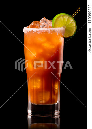 Michelada cocktail in beer glass featuring with beer, lime juice, tomato juice, spicy sauce and spices on black. Michelada cocktail in beer glass featuring with beer, lime juice, tomato juice, spicy sauce and spices on black. 110399361