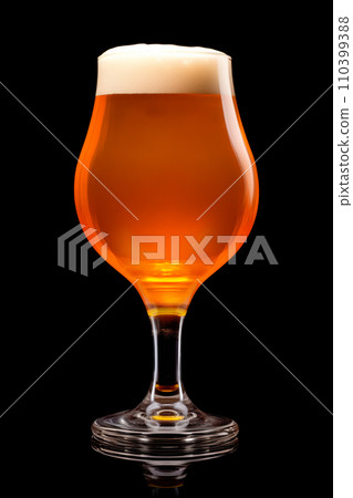 Beer in a tall glass on a dark black background. Mugs with drink like Ipa, Pale Ale, Pilsner, Porter or Stout 110399388