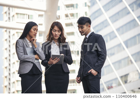 Diversity Business Partner meeting trust in teamwork and partnership businessman, businesswoman talking together in modern city. Asian coworker team meeting with Business People Working Together Team 110400646