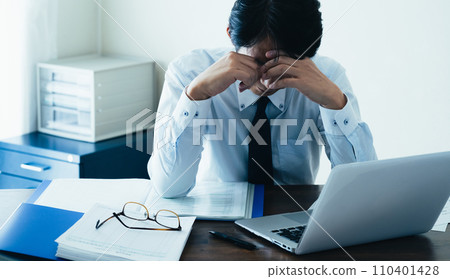 Businessman tired from working long hours Businessman tired from working long hours 110401428