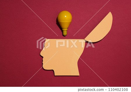 Paper human head with a light bulb Paper human head with a light bulb 110402108