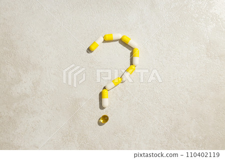 Question mark made of pills on a white background Question mark made of pills on a white background 110402119