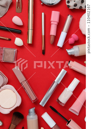 Decorative cosmetics on red background, top view 110402167