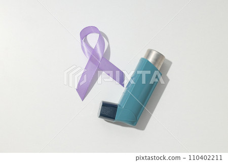 Epilepsy day concept, inhaler with lavender ribbon Epilepsy day concept, inhaler with lavender ribbon 110402211