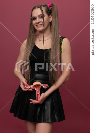 woman holds model of female reproductive system in the hands. Help and care concept woman holds model of female reproductive system in the hands. Help and care concept 110402860