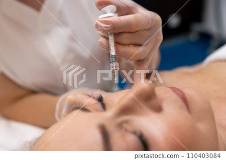 Female patient having anti age treatment at cosmetologist Female patient having anti age treatment at cosmetologist 110403084
