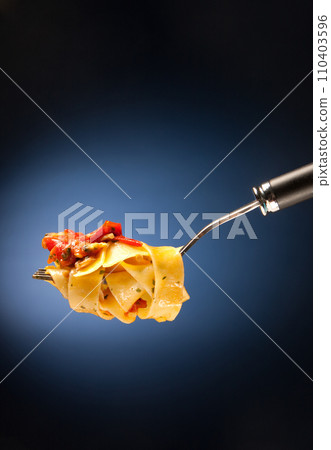 Tagliatelle with clams on a red background Tagliatelle with clams on a red background 110403596