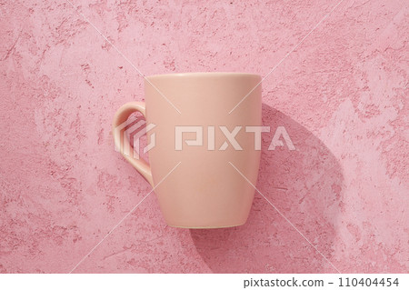 A beautiful cup on a pink background 110404454