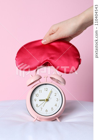 A classic alarm clock with a sleep mask A classic alarm clock with a sleep mask 110404543